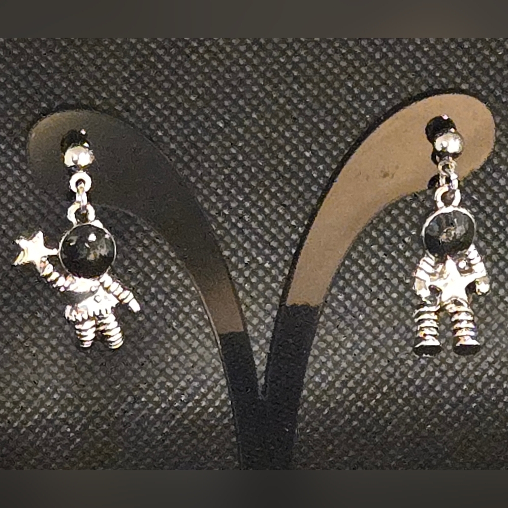 Tiny spaceman earrings